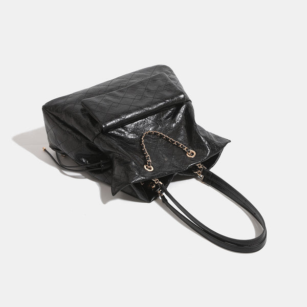 Quilted crinkled leather-look convertible tote backpack with gold-tone chain handles and drawstring closure, detail view 4