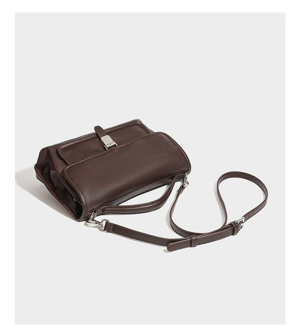 Structured rectangular satchel bag in dark espresso brown with smooth leather-look finish, flap front with silver turn-lock