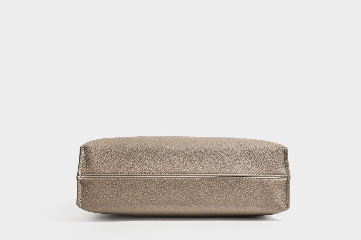 Pebbled leather-look tote bag with front toggle hardware and long shoulder strap, detail view 26