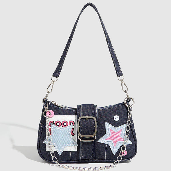 Dark navy denim-look shoulder bag with light blue and pink star appliqués, silver-tone buckle, chain strap, and short top