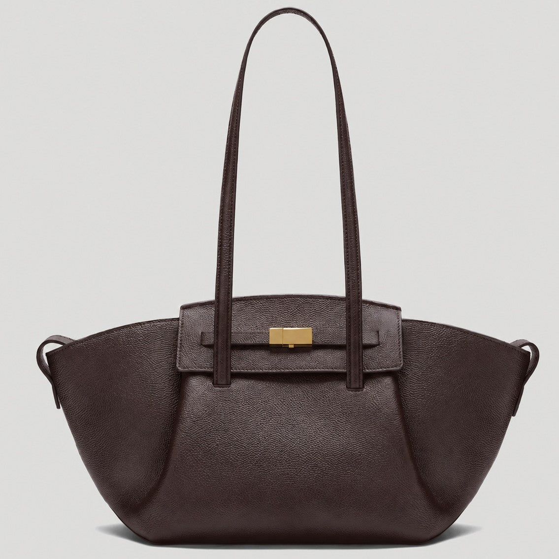 Black pebbled trapezoid tote bag with gold turn-lock hardware and double top handles, front view