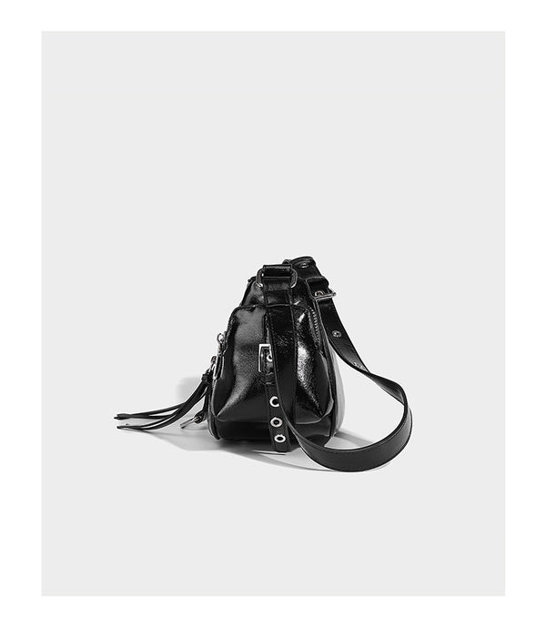Compact glossy leather-look crossbody bag with silver studs, buckle hardware, and multiple zip pockets, detail view 12