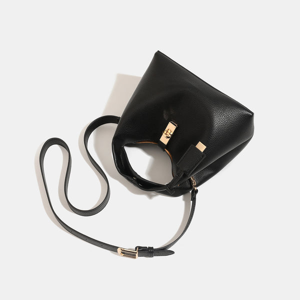 Structured pebbled leather-look bucket bag with gold-tone turn-lock clasp and looped top handle, detail view 4