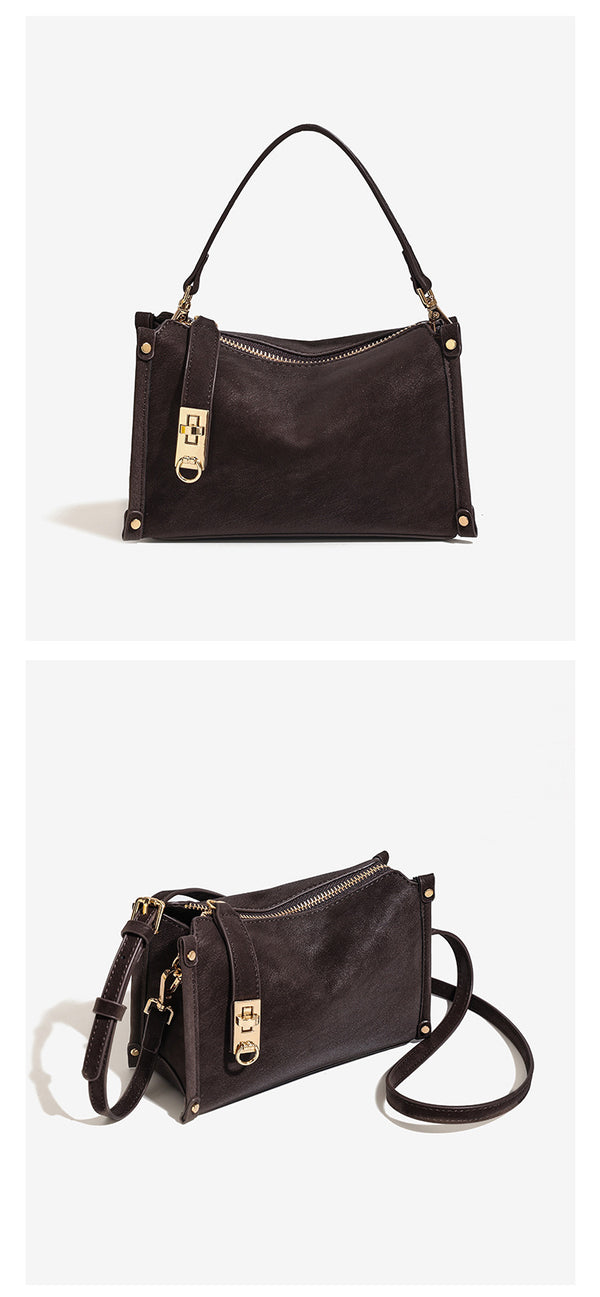 Small structured square handbag in deep dark brown matte pebbled finish with gold-tone turn-lock clasp, top zipper, corner