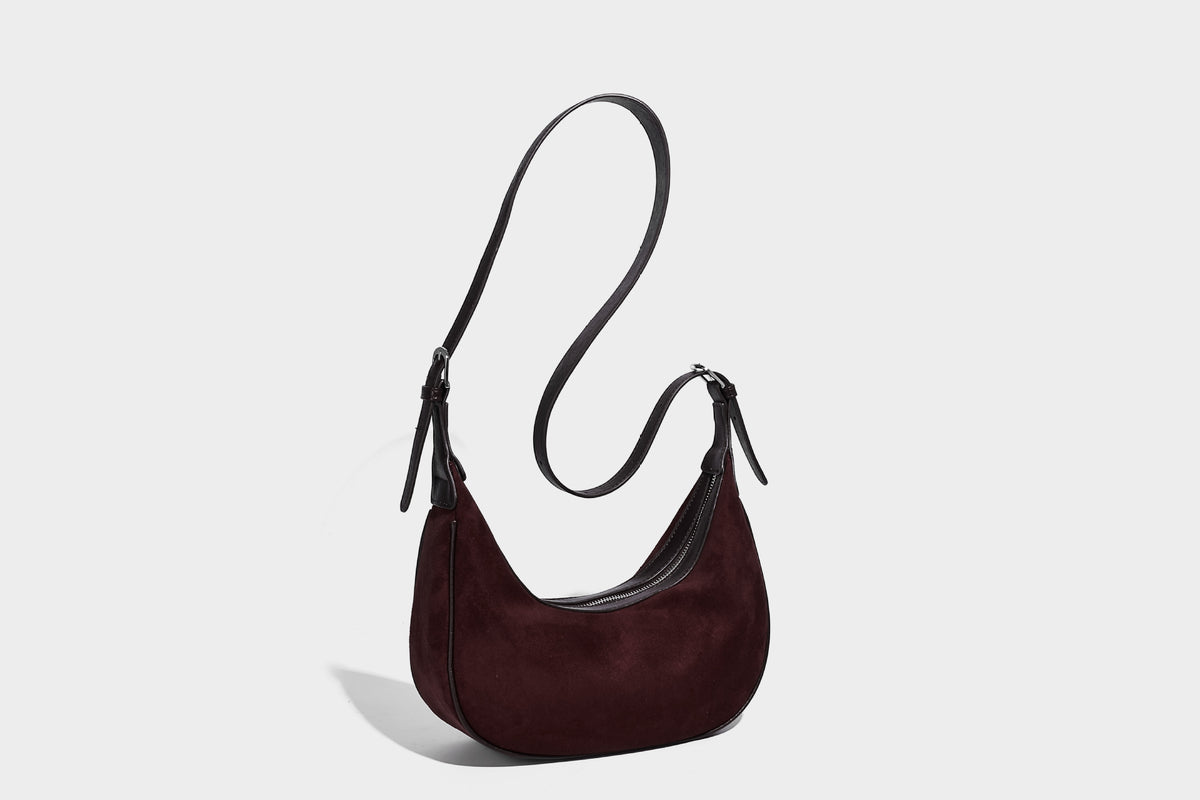 Crescent hobo shoulder bag in matte suede-look finish with black trim and adjustable strap, detail view 25