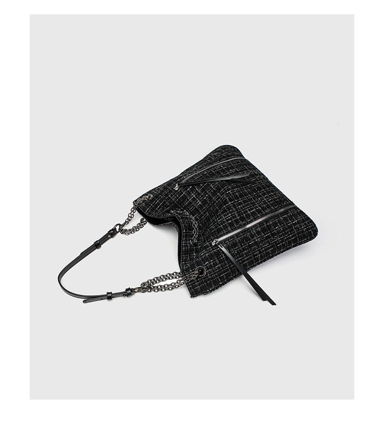 Große schwarze Schulter-Tote-Bag mit Tweedstruktur, silberfarbener Kette und Riemen in Lederoptik, Metallösen und Außenreißverschluss