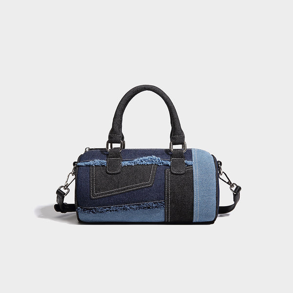 Mini barrel handbag in light and dark denim patchwork with frayed seam trim, dual top handles, top zip closure, and, detail