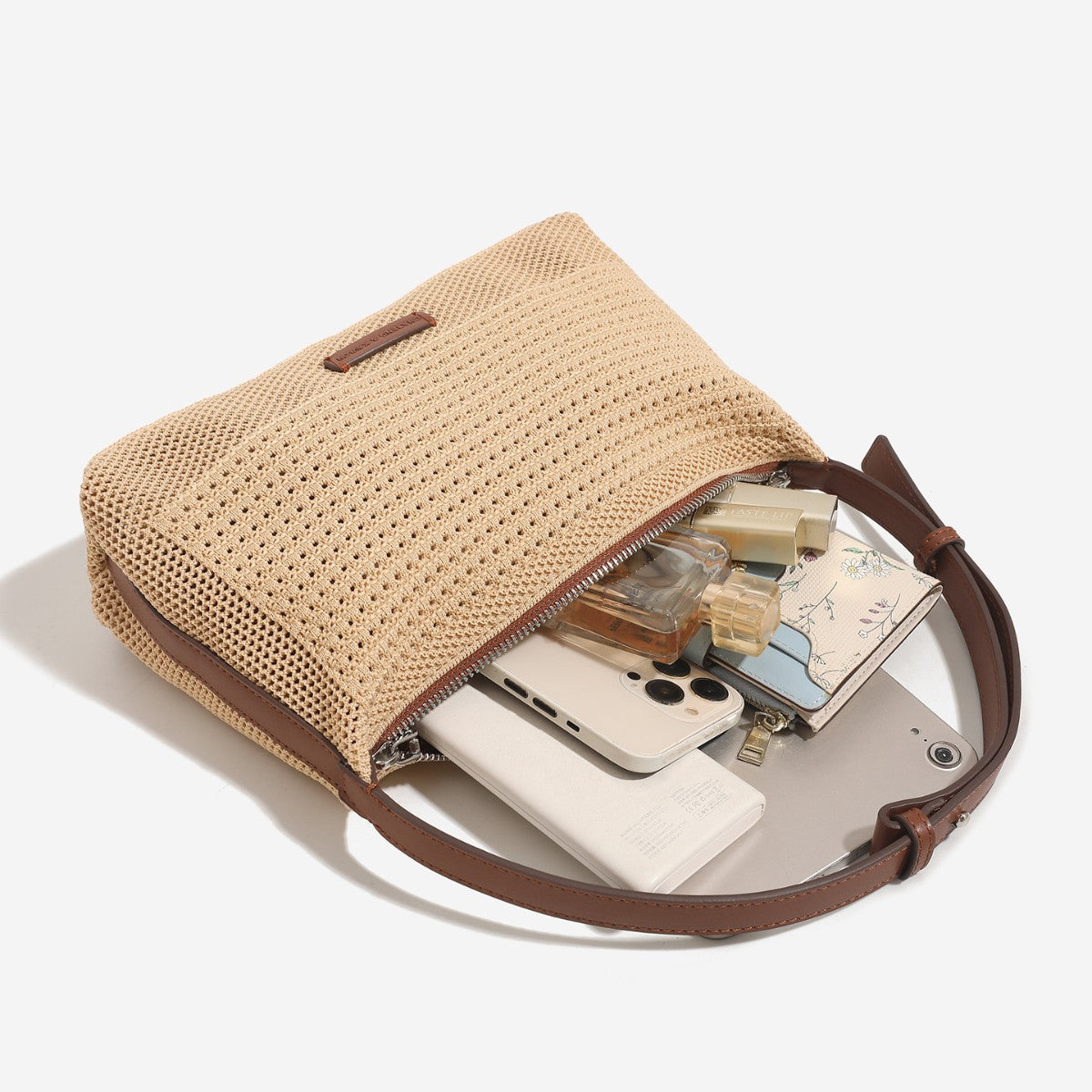 Woven crescent hobo shoulder bag with adjustable leather-look strap and top zip closure, detail view 4