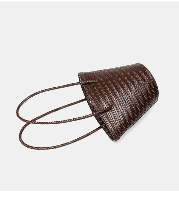Woven herringbone-texture bucket bag with braided rope shoulder strap in dark brown, detail view 12