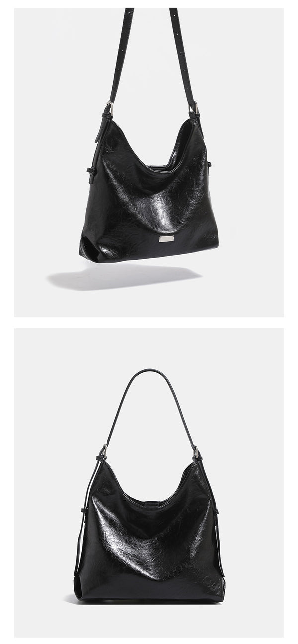 Slouchy hobo shoulder bag with glossy wrinkled leather-look finish, adjustable strap, and snap closure, detail view 10