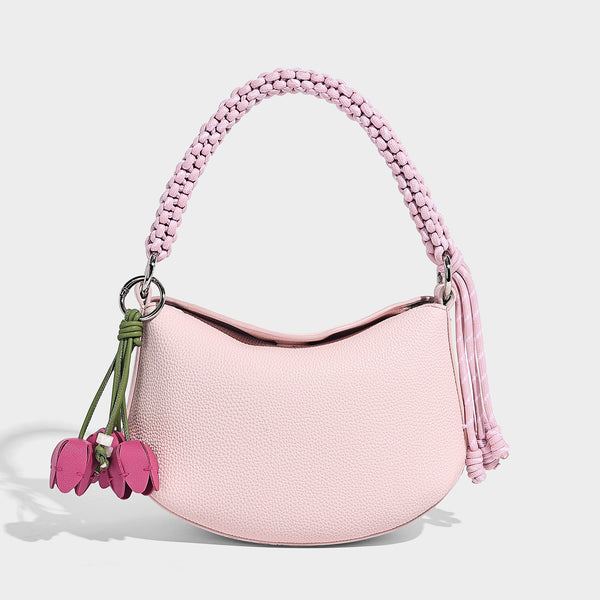 Small crescent half-moon bag in pebbled leather-look finish with braided top handle, silver-tone ring hardware, and, detail
