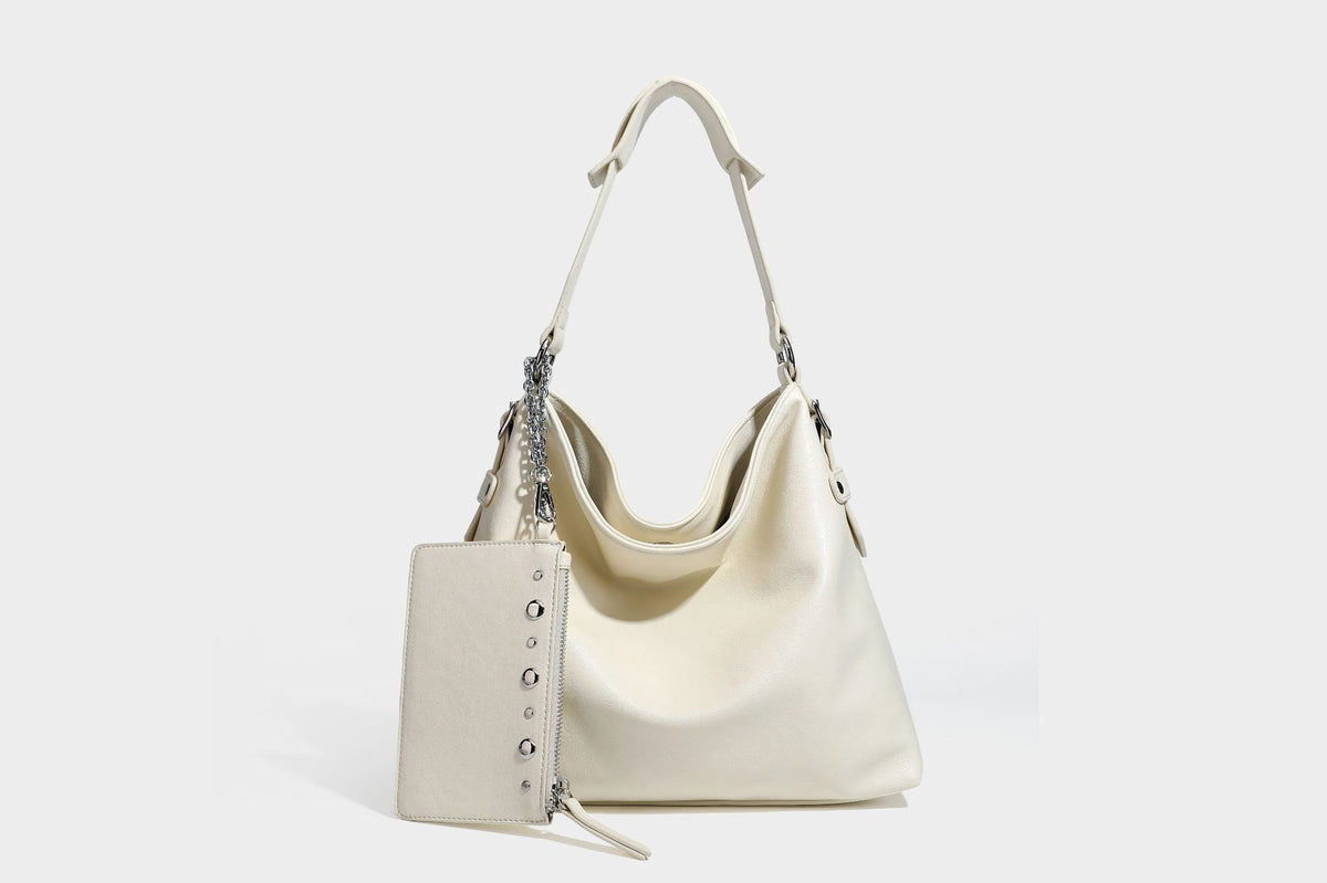 Large slouchy hobo shoulder bag in dark brown with smooth leather-look finish, adjustable strap, and silver-tone hardware