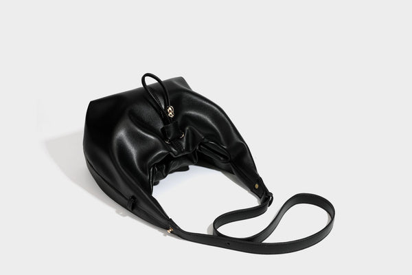 Slouchy hobo bag with smooth leather-look finish, drawstring cinch closure, and gold-tone bead hardware, detail view 36