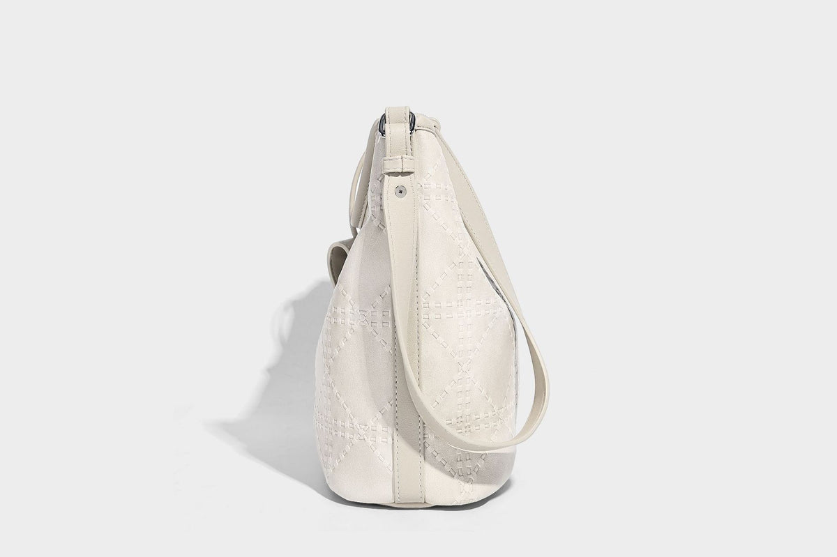 Diamond-quilted leather-look bucket shoulder bag with knotted strap accent and attached mini pouch, detail view 23