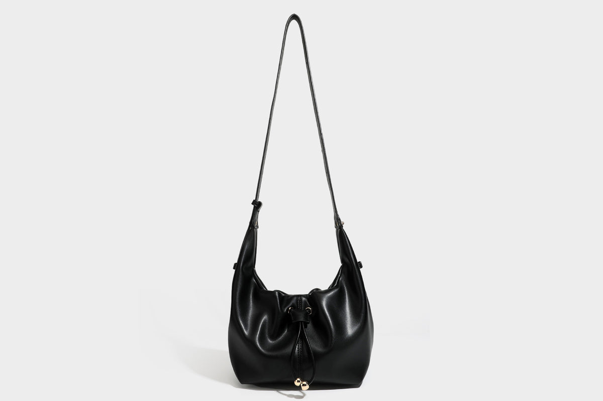 Slouchy hobo bag with smooth leather-look finish, drawstring cinch closure, and gold-tone bead hardware, detail view 35