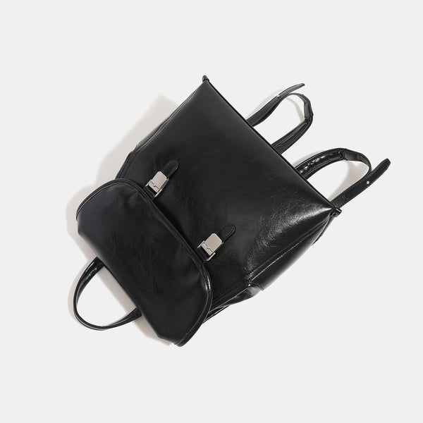Structured glossy leather-look flap backpack with twin buckle closures and top grab handle, detail view 4