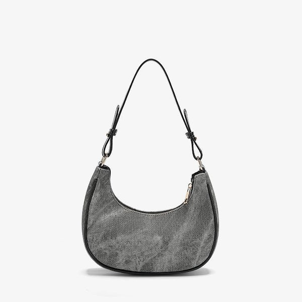 Small gray crescent half-moon shoulder bag with black leather-look trim, gold-tone zipper, and adjustable slim strap, front