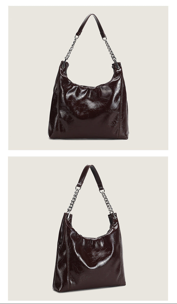 Glossy crinkled leather-look slouchy hobo bag with silver chain-and-leather shoulder strap and open top, detail view 9