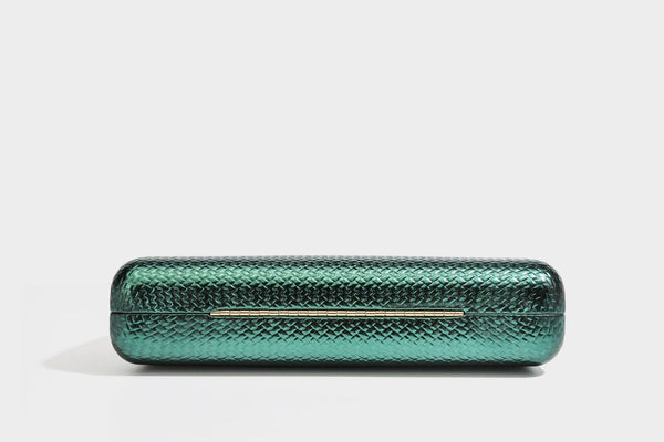 Structured rectangular metallic woven clutch bag with sculptural gold-tone leaf top handle and detachable chain strap, detail