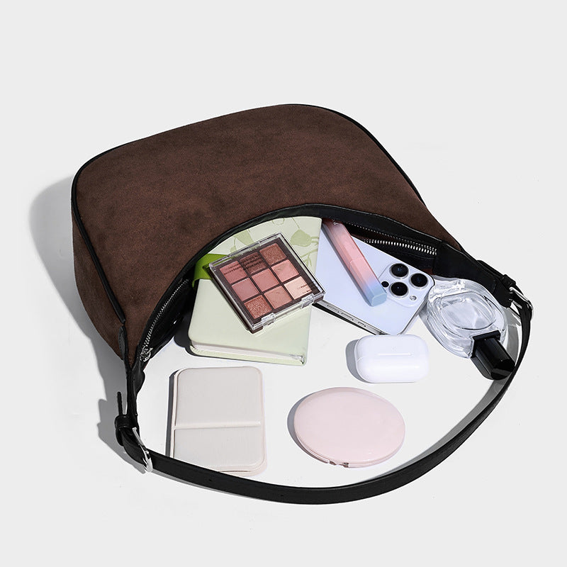 Crescent hobo shoulder bag in matte suede-look finish with black trim and adjustable strap, detail view 4