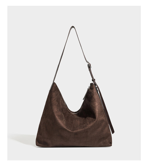 Slouchy croc-embossed matte hobo shoulder bag with adjustable strap and top zip closure, detail view 11
