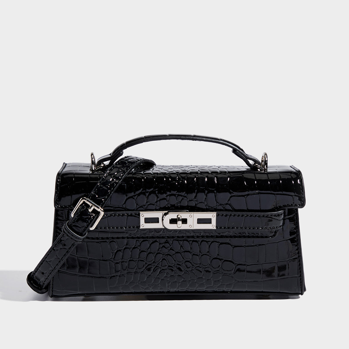 Compact structured flap satchel with glossy crocodile-embossed leather-look finish, silver-tone turn-lock hardware, and