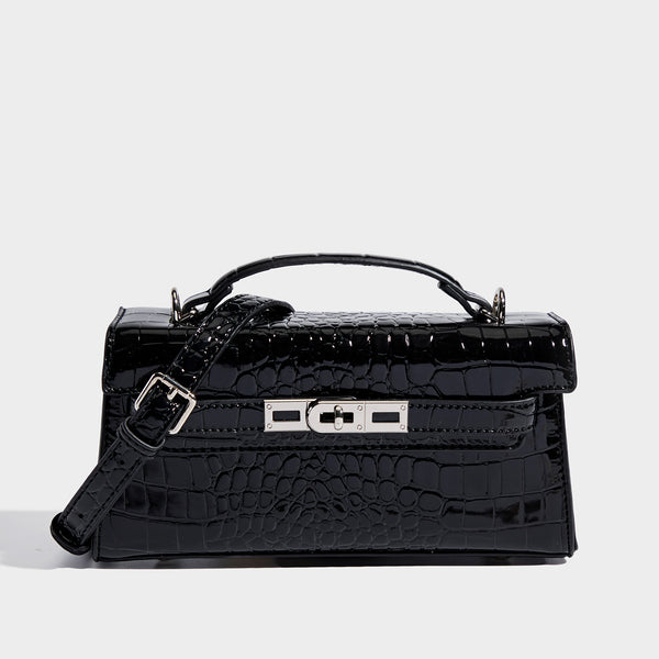 Compact structured flap satchel with glossy crocodile-embossed leather-look finish, silver-tone turn-lock hardware, and