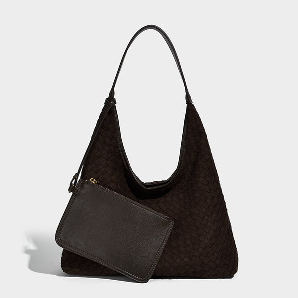 Large slouchy woven hobo tote bag with curved shoulder strap and triangular silhouette, detail view 6