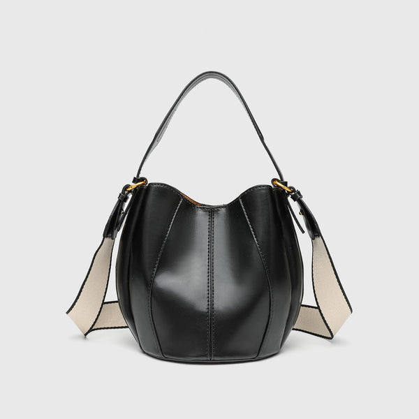 Smooth leather-look paneled bucket bag in brown with wide woven shoulder strap, gold-tone ring hardware, and detachable zip