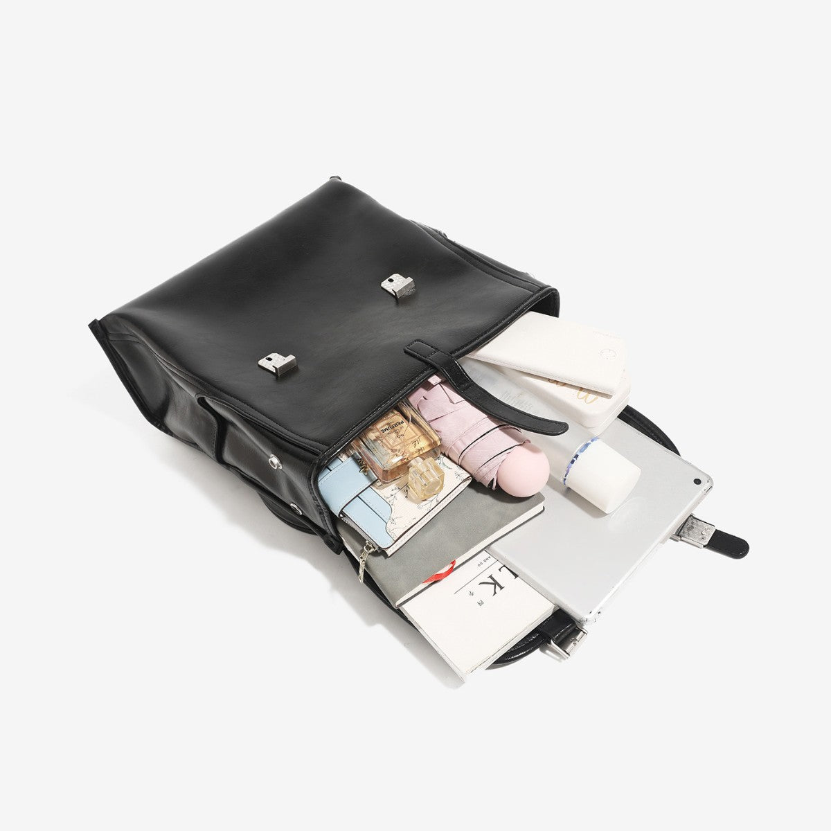 Structured glossy leather-look flap backpack handbag with dual buckle closures, top handle, and silver-tone hardware, detail