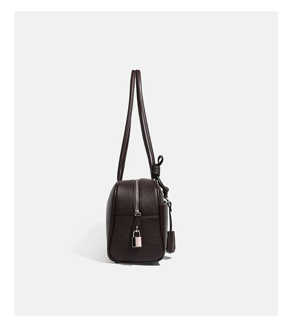 Structured rounded rectangular shoulder bag with pebbled leather-look finish, dual long handles, top zipper, front zip