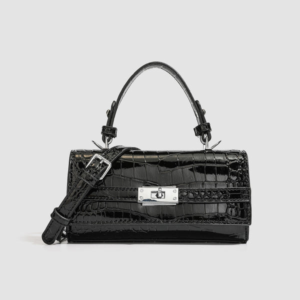 Mini-Handtasche mit strukturierter, rechteckiger Form, glänzender Krokodilprägung in Lederoptik, Drehverschluss in Silberoptik und kurzem