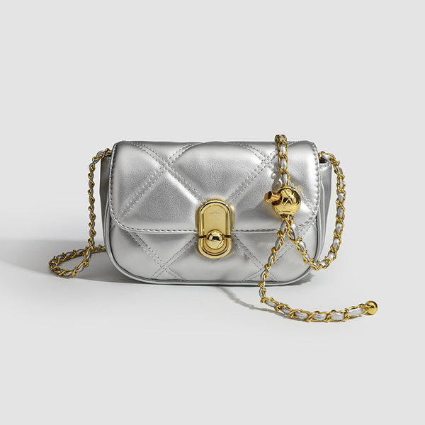 Compact diamond-quilted mini crossbody bag with gold-tone turn-lock closure and woven chain strap, detail view 8