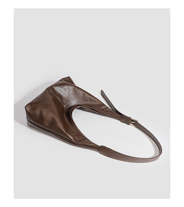 Large slouchy hobo shoulder bag in smooth leather-look finish with adjustable strap and gold-tone hardware, detail view 14