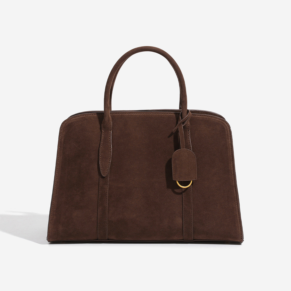 Structured trapezoid Boston satchel bag with dual top handles, gold-tone lock charm, and top zip closure, detail view 6