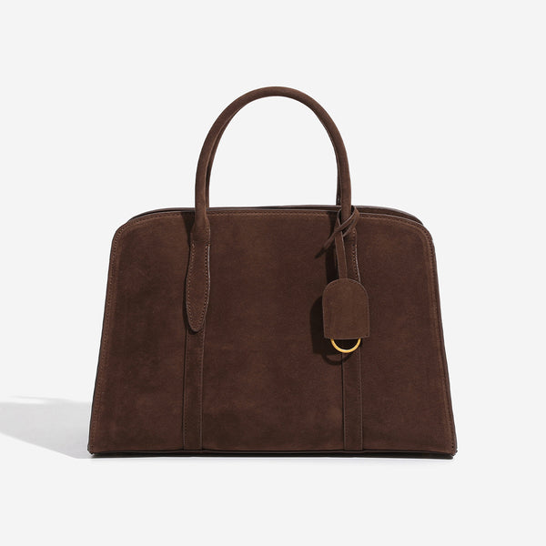 Structured trapezoid Boston satchel bag with dual top handles, gold-tone lock charm, and top zip closure, detail view 6