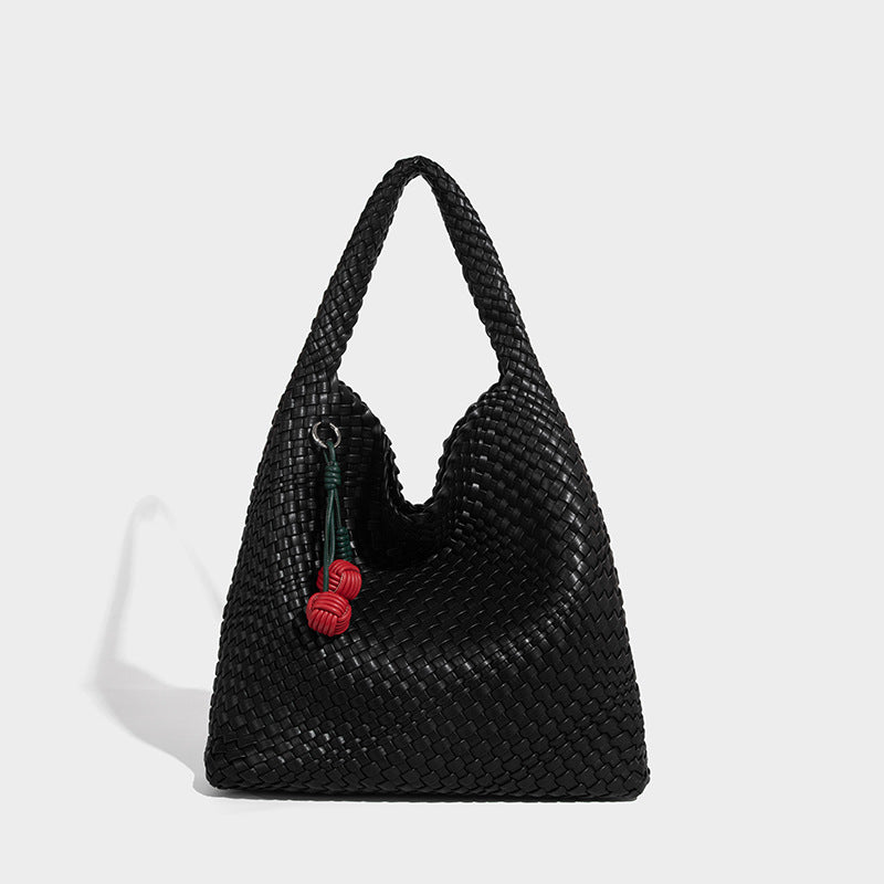 Soft hand-woven slouchy hobo tote bag with knotted tassel charm and single looped shoulder strap, detail view 6