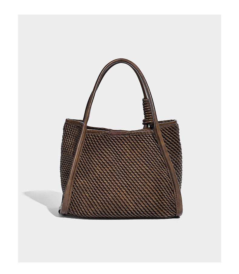 Large structured woven rope-texture tote bag with smooth leather-look trim, knotted dual top handles, detachable mini front