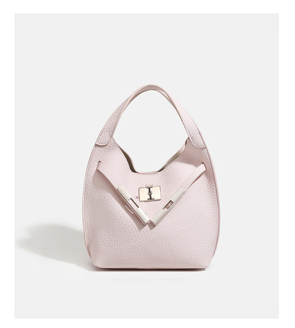 Compact pebbled leather-look shoulder bag with crossed silver-toned metal front closure, short top handle, and long, detail