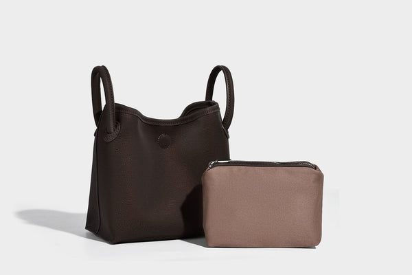Small structured matte pebbled tote bag with twin top handles and removable zip pouch, detail view 18