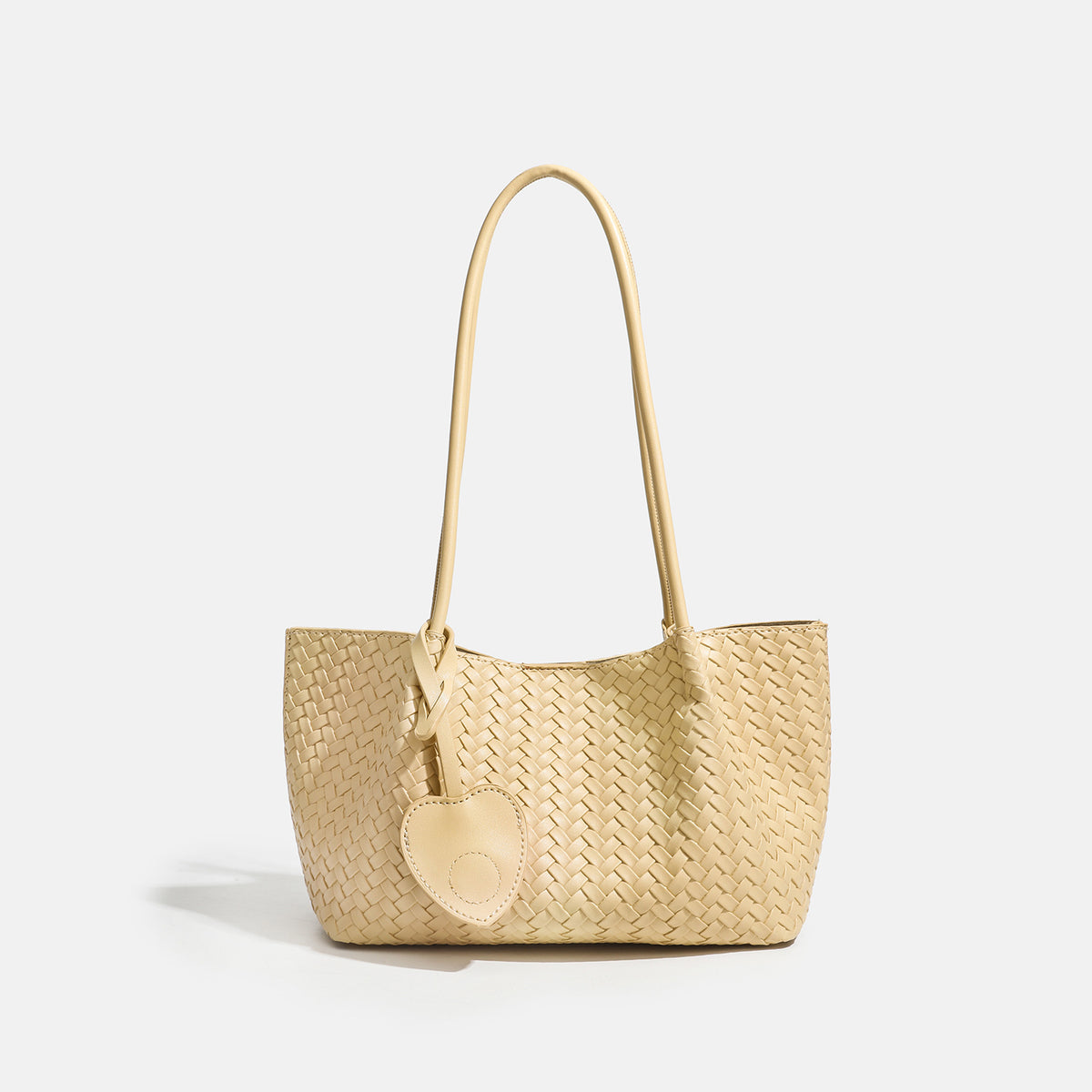 Woven leather-look tote bag in yellow with long shoulder straps, heart-shaped hanging charm, and removable inner zip pouch