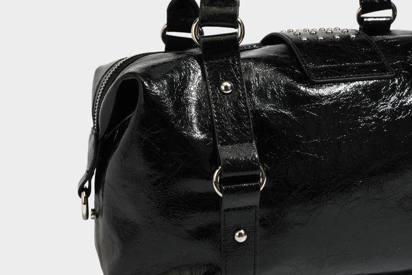 Glossy crinkled barrel handbag with silver stud buckle strap and detachable shoulder strap, detail view 30
