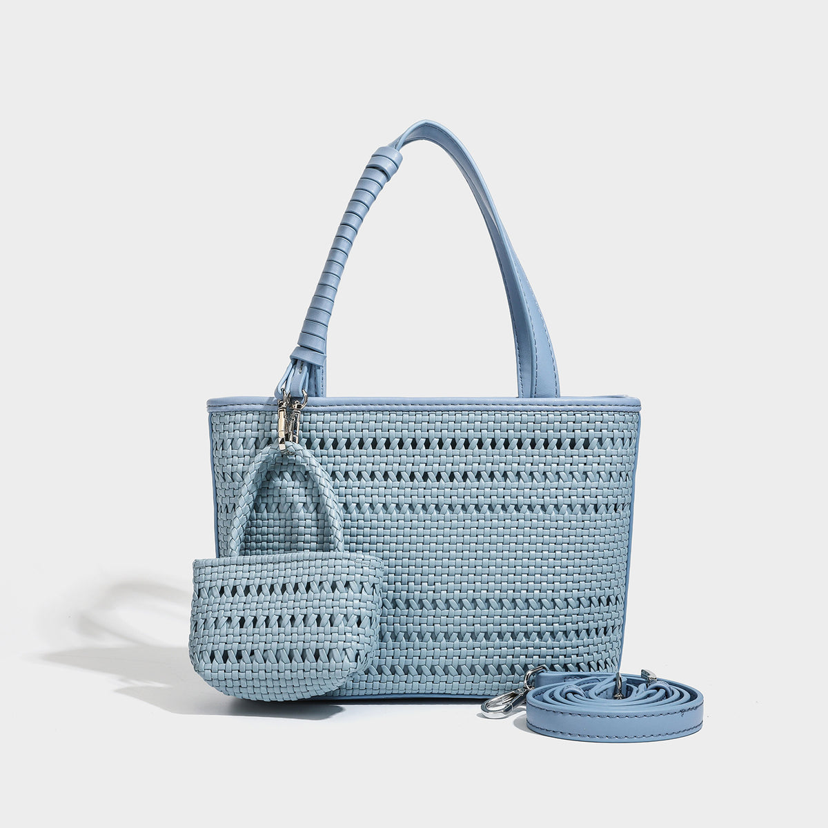 Structured open-weave tote bag with smooth leather-look trim, double top handles, detachable crossbody strap, and mini zip