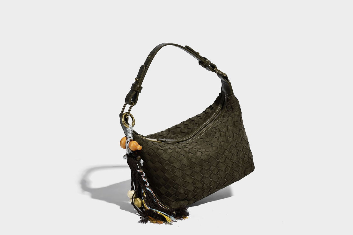 Small woven-texture crescent hobo bag in dark chocolate brown with top zip closure, gold-tone hardware, and adjustable