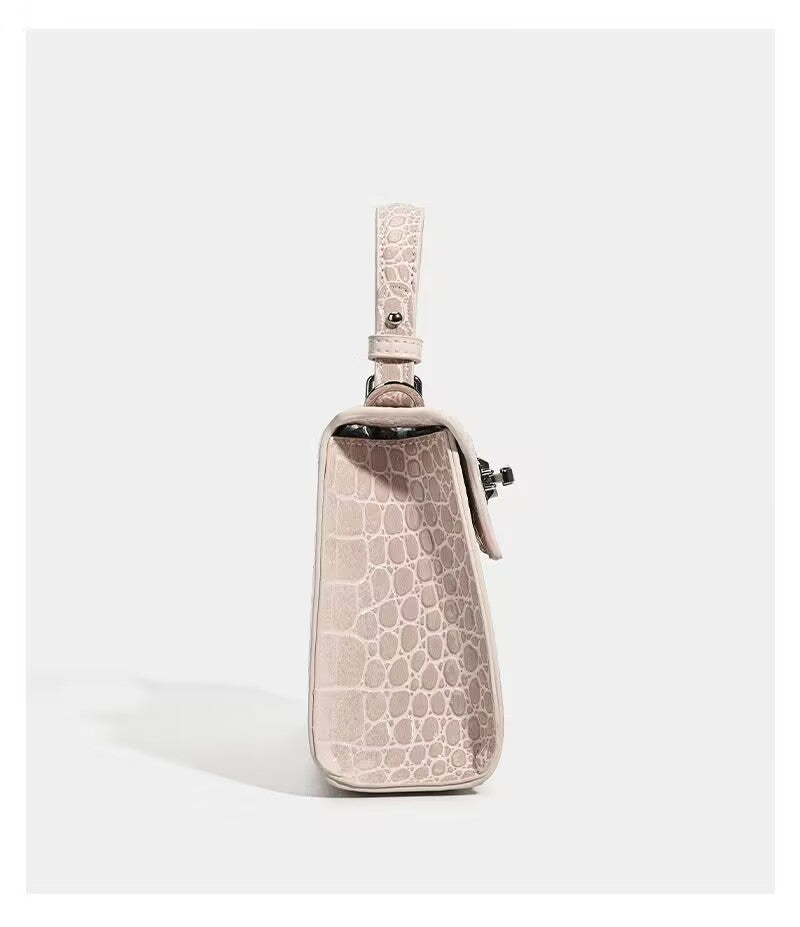 Croc-embossed mini top-handle satchel with silver turn-lock closure and adjustable crossbody strap, detail view 22