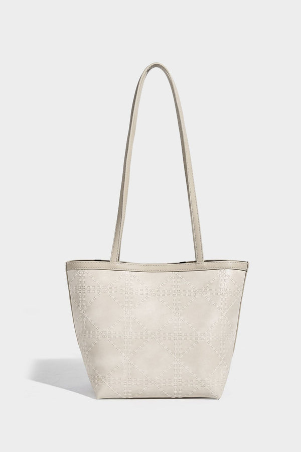 Quilted diamond-pattern tote bag with attached front zip pouch and long shoulder straps, detail view 23