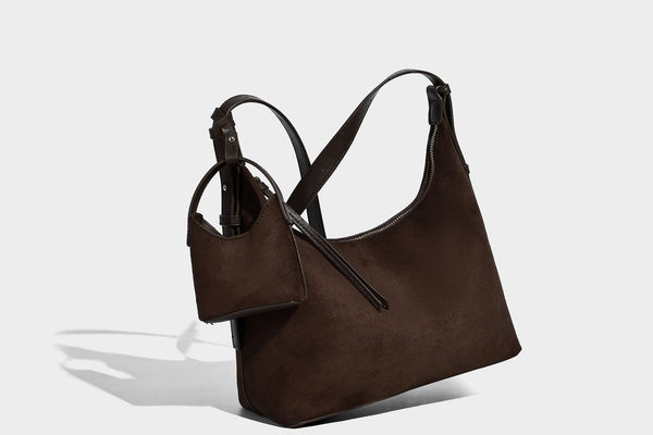 Dark brown suede-look hobo shoulder bag with top zip closure, adjustable strap, and small detachable mini pouch, detail view