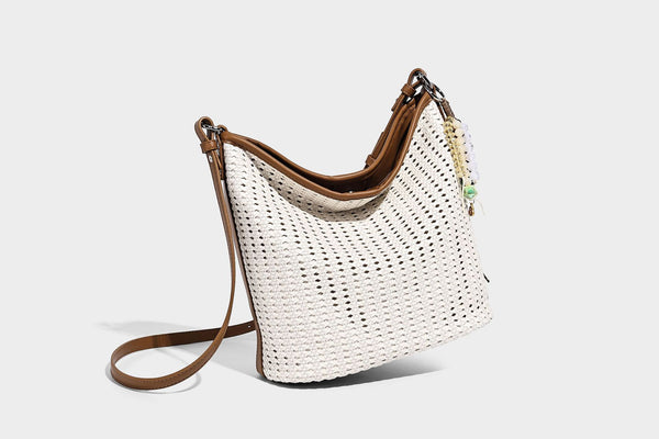 Slouchy open-weave hobo shoulder bag with leather-look trim, beaded tassel charm, and adjustable strap, detail view 17