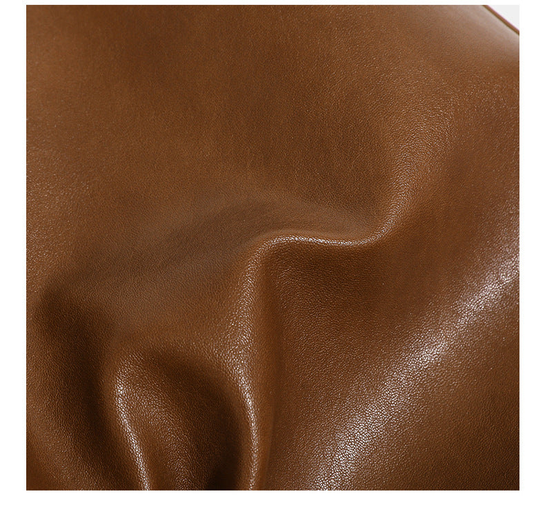 Smooth leather-look hobo bag with gold-tone ring hardware, contrast stitching, top handle and adjustable crossbody strap