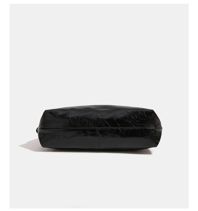 Glossy crinkled hobo shoulder bag with gold-tone logo hardware and adjustable strap, detail view 8